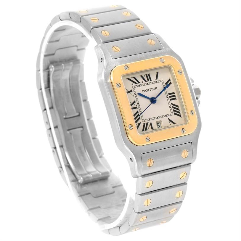 The image shows a Santos model by Cartier at an angle, highlighting its face, bezel, and part of the metal bracelet.