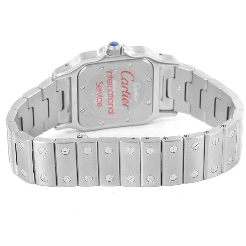 This image shows the back and bracelet of the Santos model by Cartier, displaying its metal links and case back.