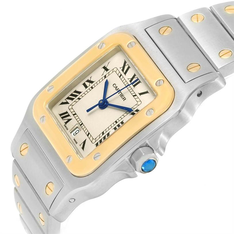 This image shows a partial view of a Cartier Santos W20011C4 Stainless Steel Silver Dial W20011C4 Stainless Steel Silver Dial watch, focused on the face, bezel, and part of the bracelet.