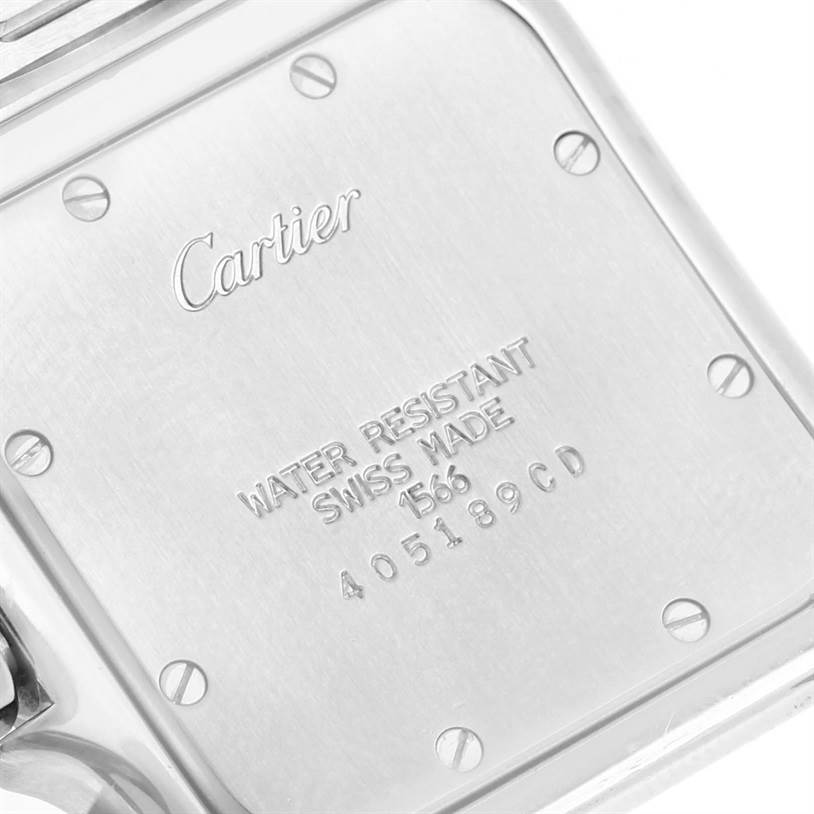 The image shows the back case of the Santos model by Cartier, featuring engraved branding and specifications.
