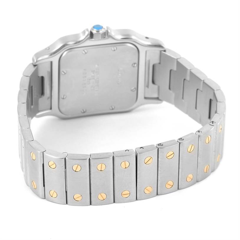 The image shows the backside and bracelet of a Santos model by Cartier, highlighting the case back and two-tone bracelet.