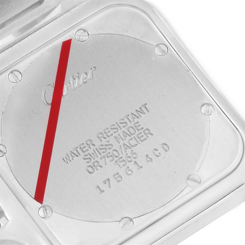 The image shows the back case of a Santos model watch by Cartier, highlighting its inscriptions and screws.