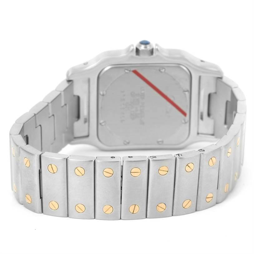 The image shows the back case and bracelet of the Santos model watch by Cartier from an angled rear view.