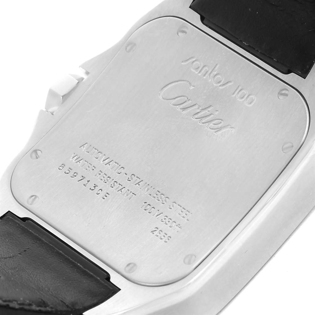 The image shows the back case of a Cartier Santos W20073X8 Men's Stainless Steel Silver Dial W20073X8 Men's Stainless Steel Silver Dial watch, displaying its engraving and some strap attachments.