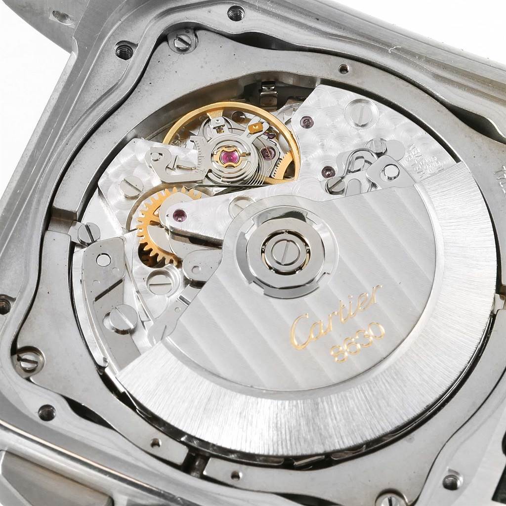The image shows the movement of a Cartier Santos W20090X8 Men
s Stainless Steel Silver Dial W20090X8 Men
s Stainless Steel Silver Dial model watch, focusing on its intricate internal mechanics.