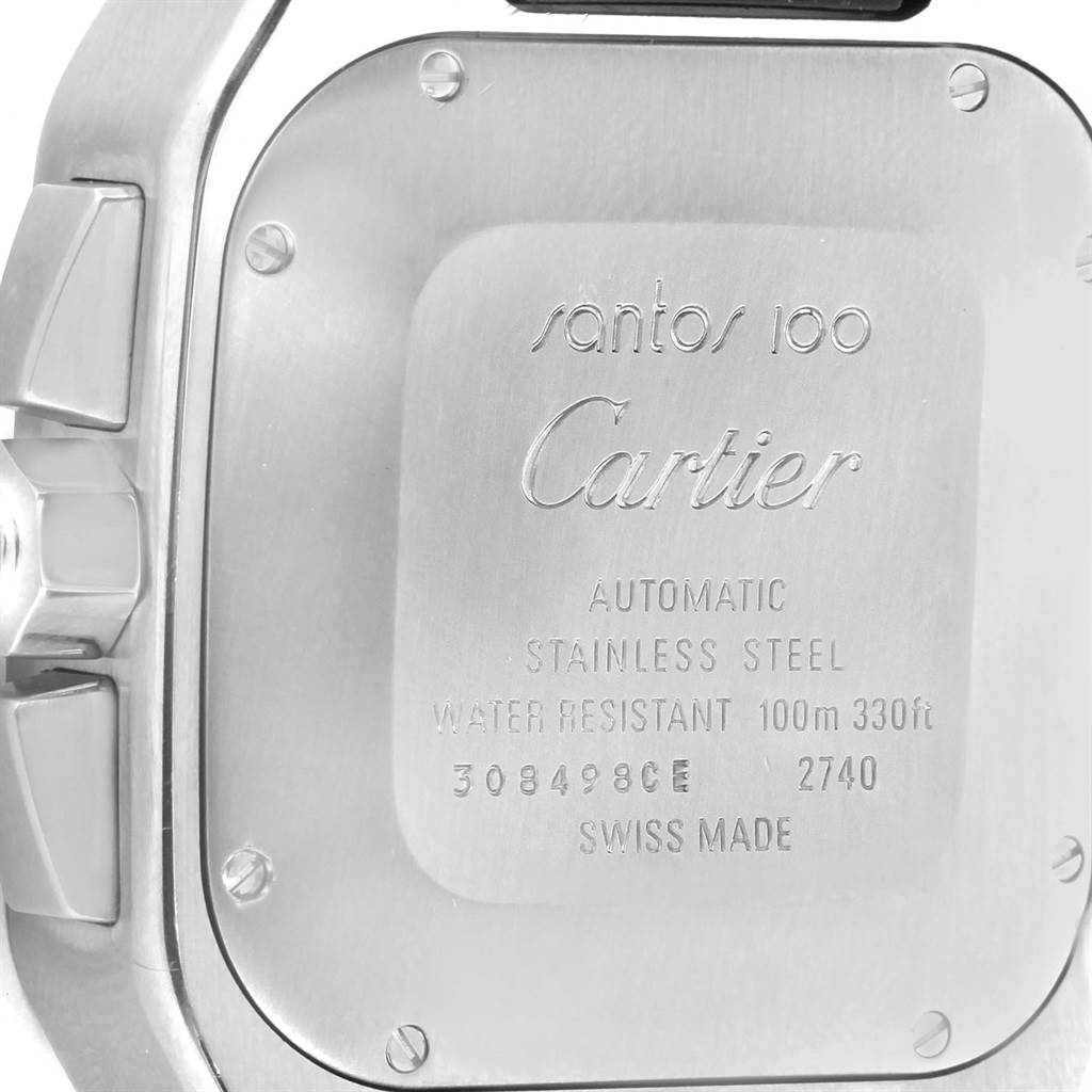 This image shows the back case of the Cartier Santos W20090X8 Men
s Stainless Steel Silver Dial W20090X8 Men
s Stainless Steel Silver Dial model watch including engraved details and part of the crown.