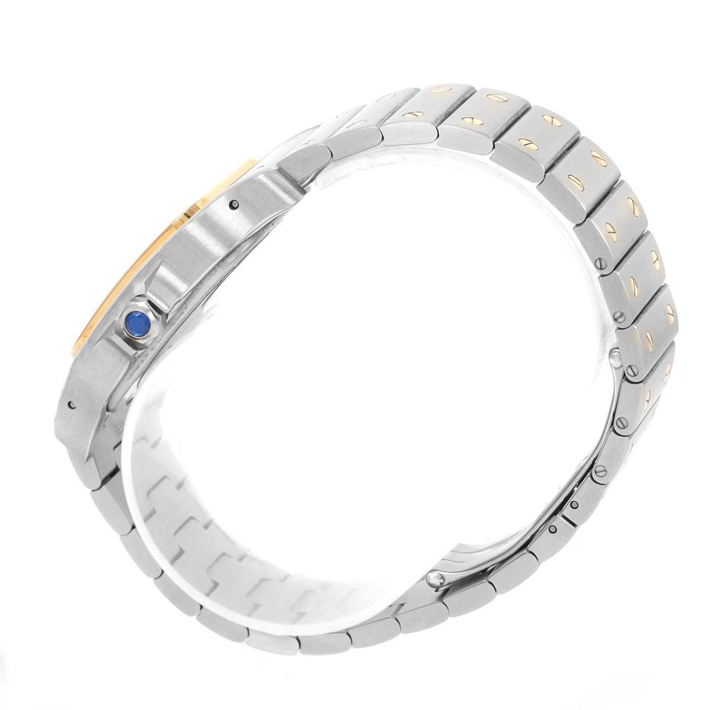 The image shows a side view of a Cartier Santos W20099C4 Men
s Stainless Steel Silver Dial W20099C4 Men
s Stainless Steel Silver Dial watch, highlighting its metal strap and crown with a blue cabochon.