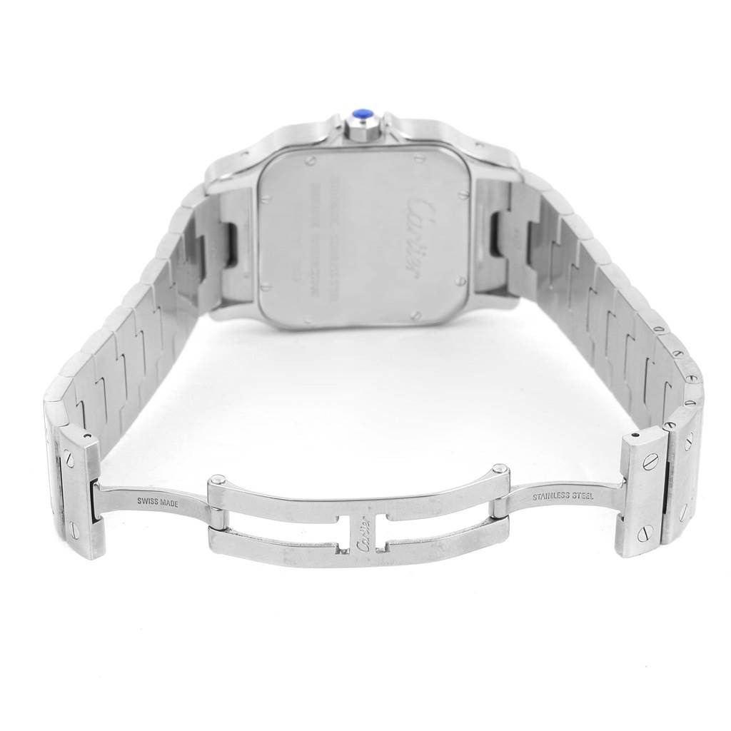 This image shows the back and open clasp of a Cartier Santos W20098D6 Men's Stainless Steel Silver Dial W20098D6 Men's Stainless Steel Silver Dial watch, highlighting its stainless steel bracelet and engraved case back.