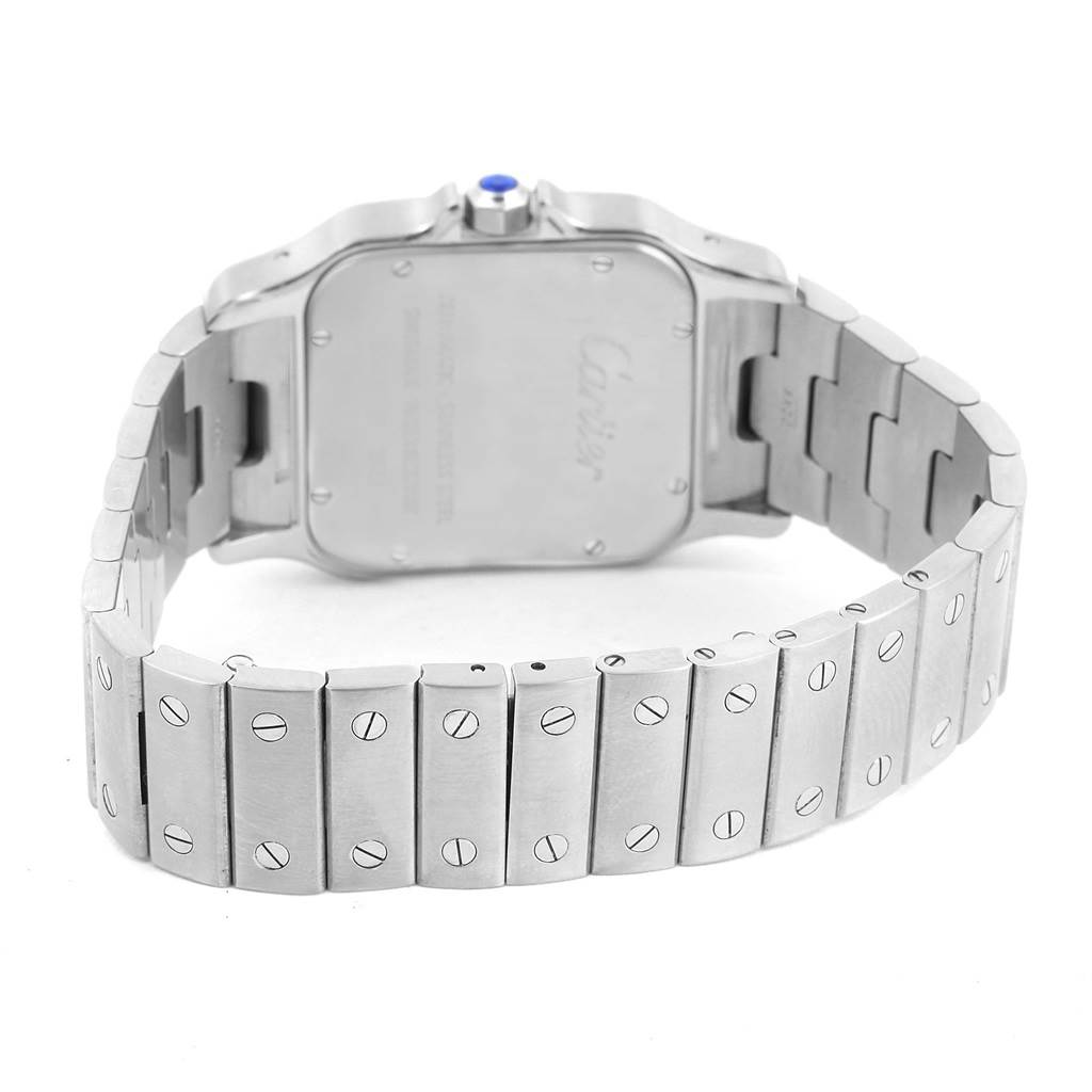 The image shows the back and bracelet of a Santos model watch by Cartier.