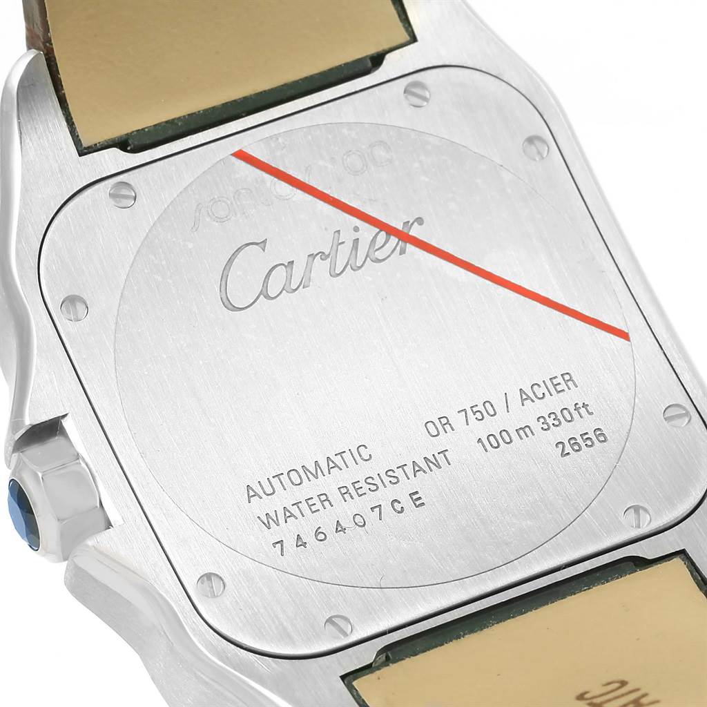 This image shows the back case of the Santos model by Cartier, highlighting its inscriptions and water resistance specifications.