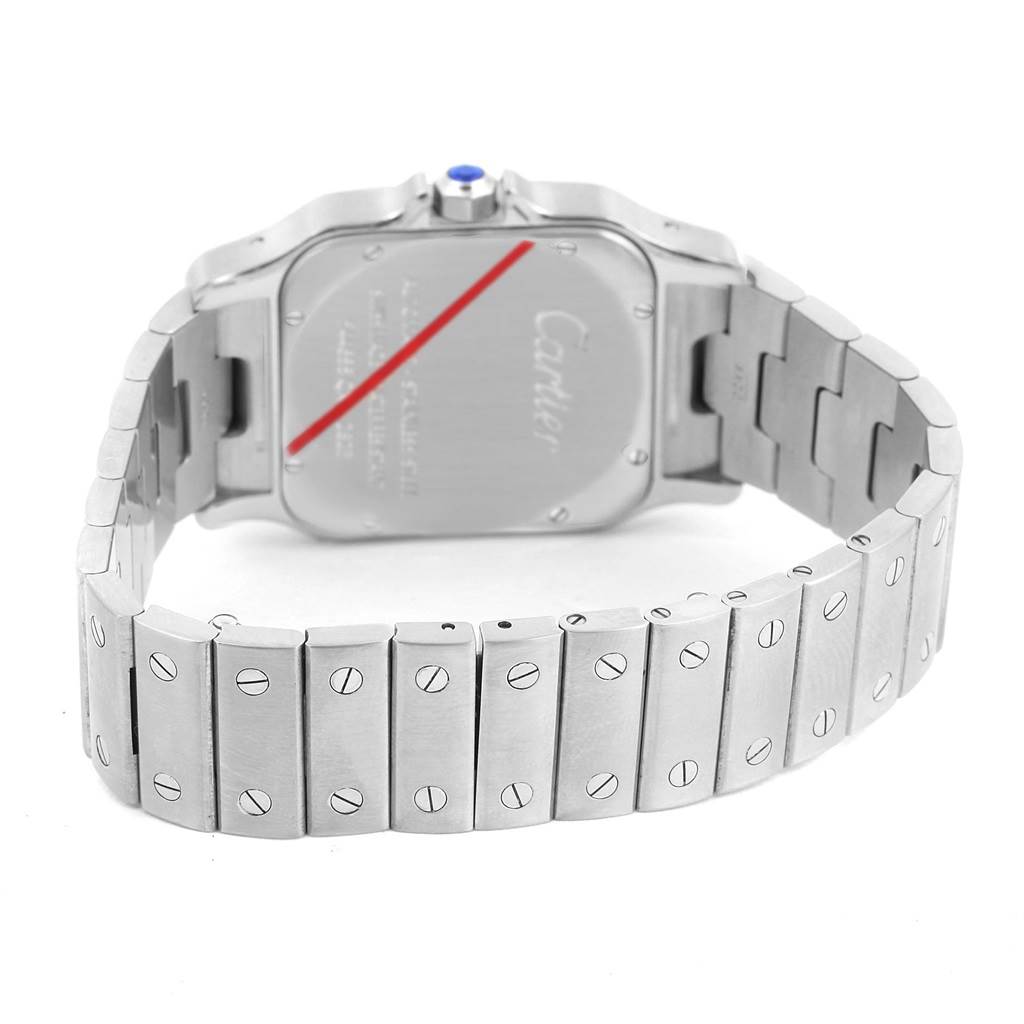 The image shows the back case and bracelet of a Santos model watch by Cartier.