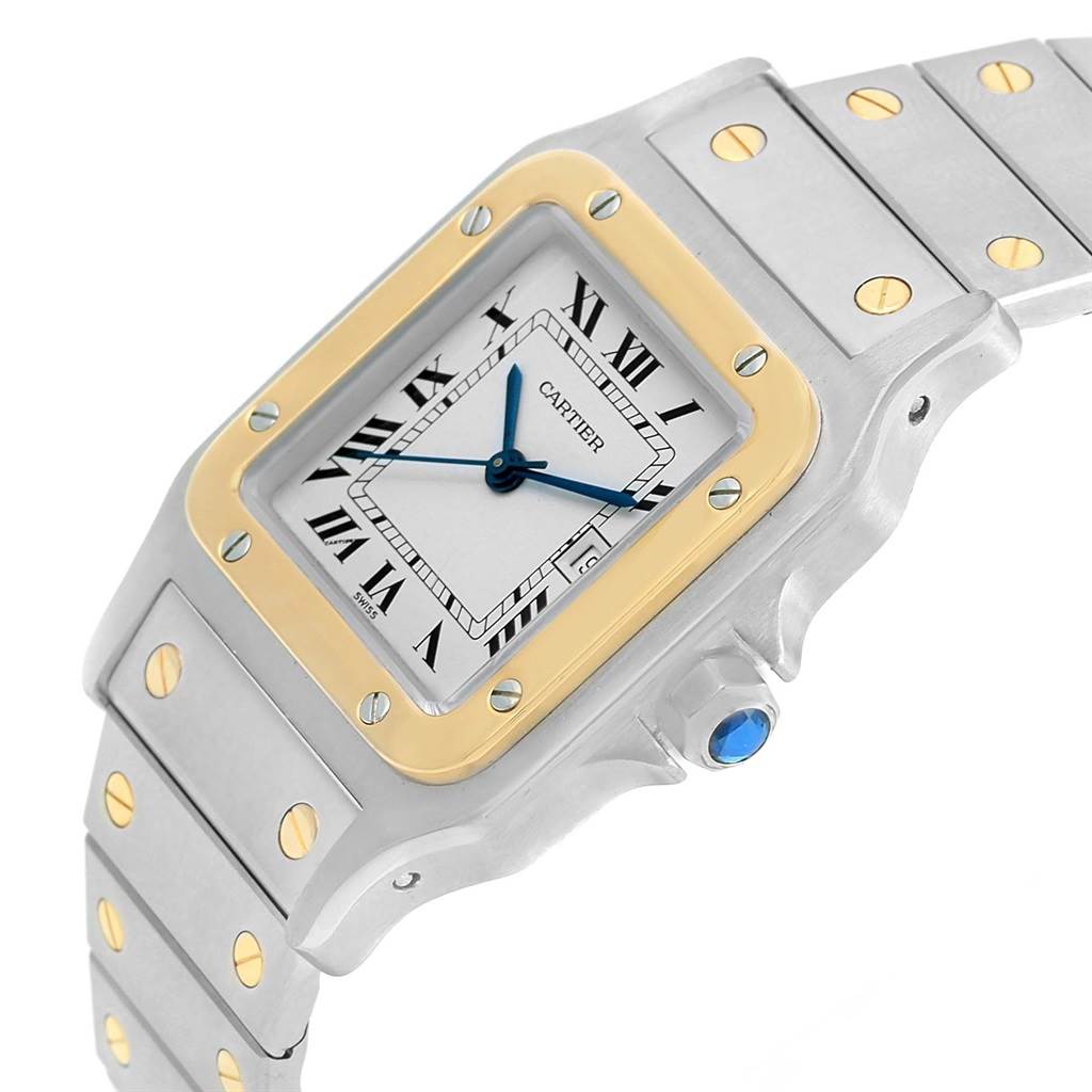 The image shows a Cartier Santos W20058C4 Men
s Stainless Steel Silver Dial W20058C4 Men
s Stainless Steel Silver Dial watch from an angled view, highlighting the face, bezel, crown, and part of the bracelet.