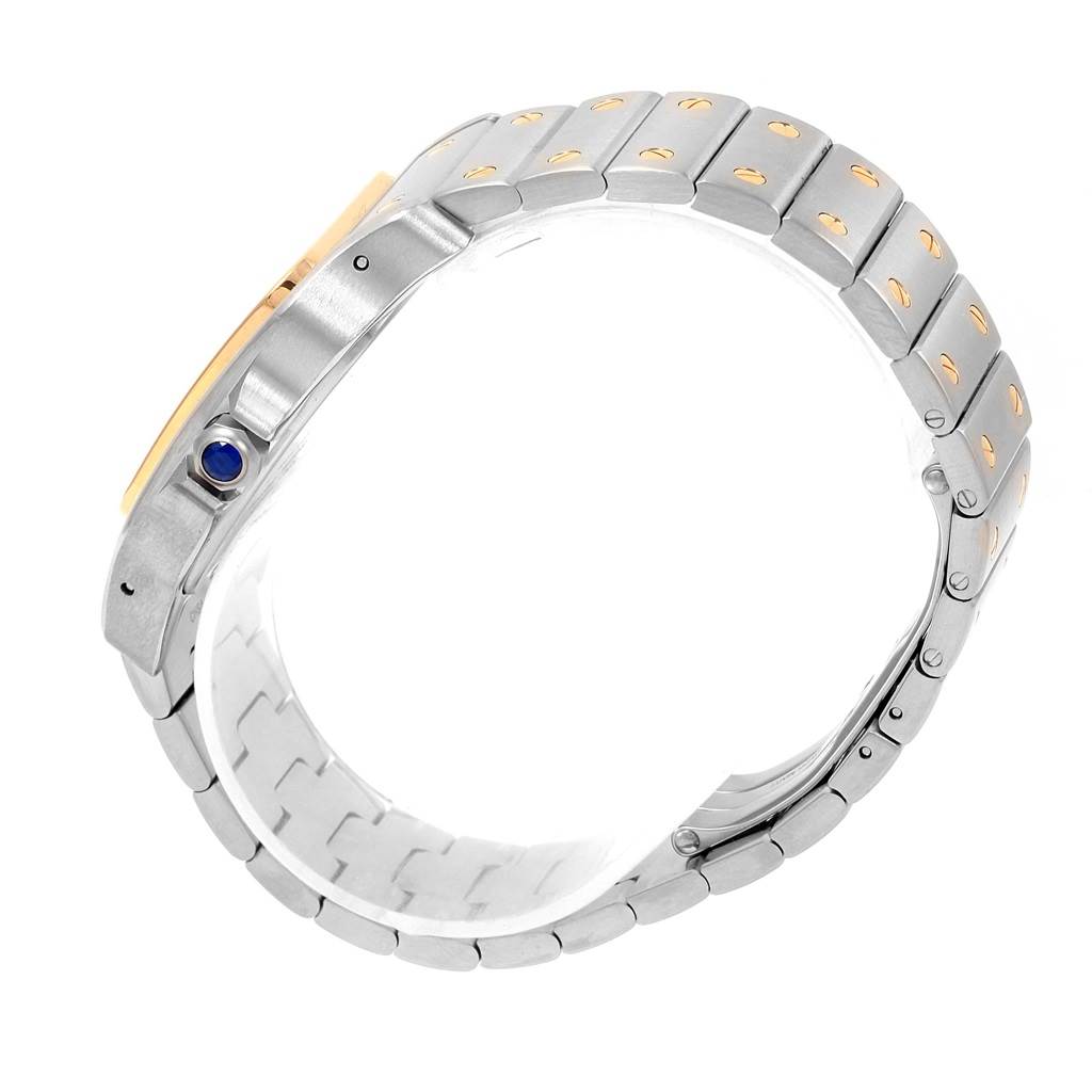 This image shows a side view of a Cartier Santos W20099C4 Men
s Stainless Steel Silver Dial W20099C4 Men
s Stainless Steel Silver Dial watch
s bracelet and crown with a blue cabochon.