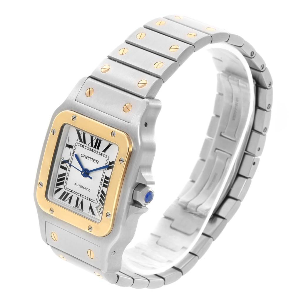 The image shows a Cartier Santos W20099C4 Men
s Stainless Steel Silver Dial W20099C4 Men
s Stainless Steel Silver Dial watch at an angle highlighting its face, bracelet, and crown.