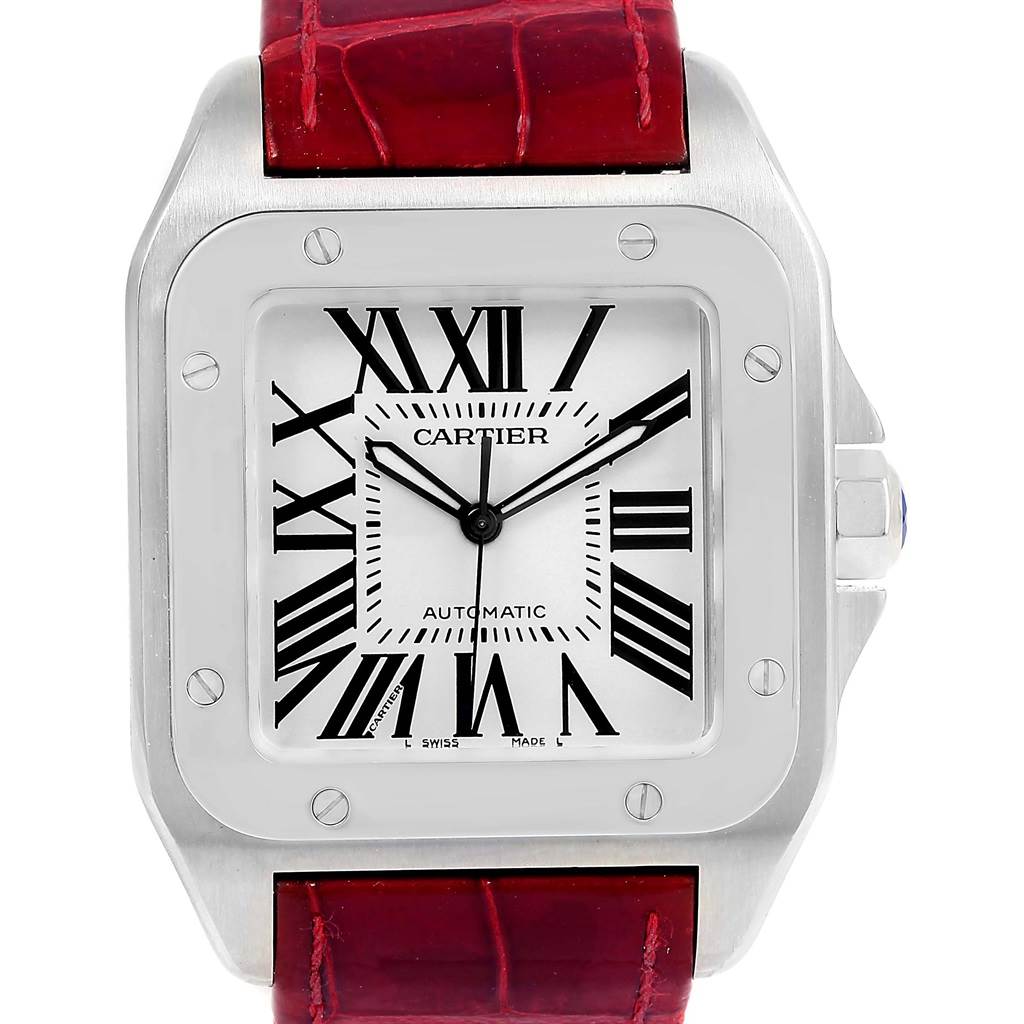 This image shows a frontal view of a Cartier Santos W20073X8 Men
s Stainless Steel Silver Dial W20073X8 Men
s Stainless Steel Silver Dial watch, featuring a square dial with Roman numerals and a red leather strap.
