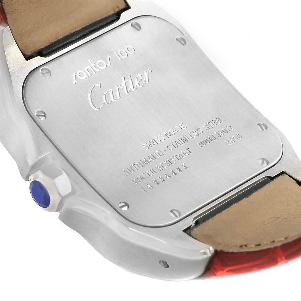 The image shows the back of a Santos model by Cartier, highlighting the case back and part of the leather strap.