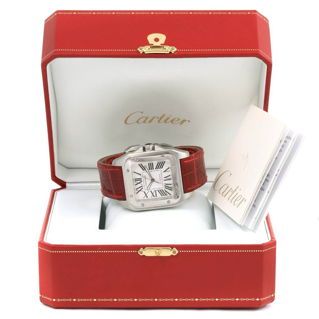 The Cartier Santos W20073X8 Men
s Stainless Steel Silver Dial W20073X8 Men
s Stainless Steel Silver Dial watch is displayed inside an open red Cartier box, accompanied by its documents.