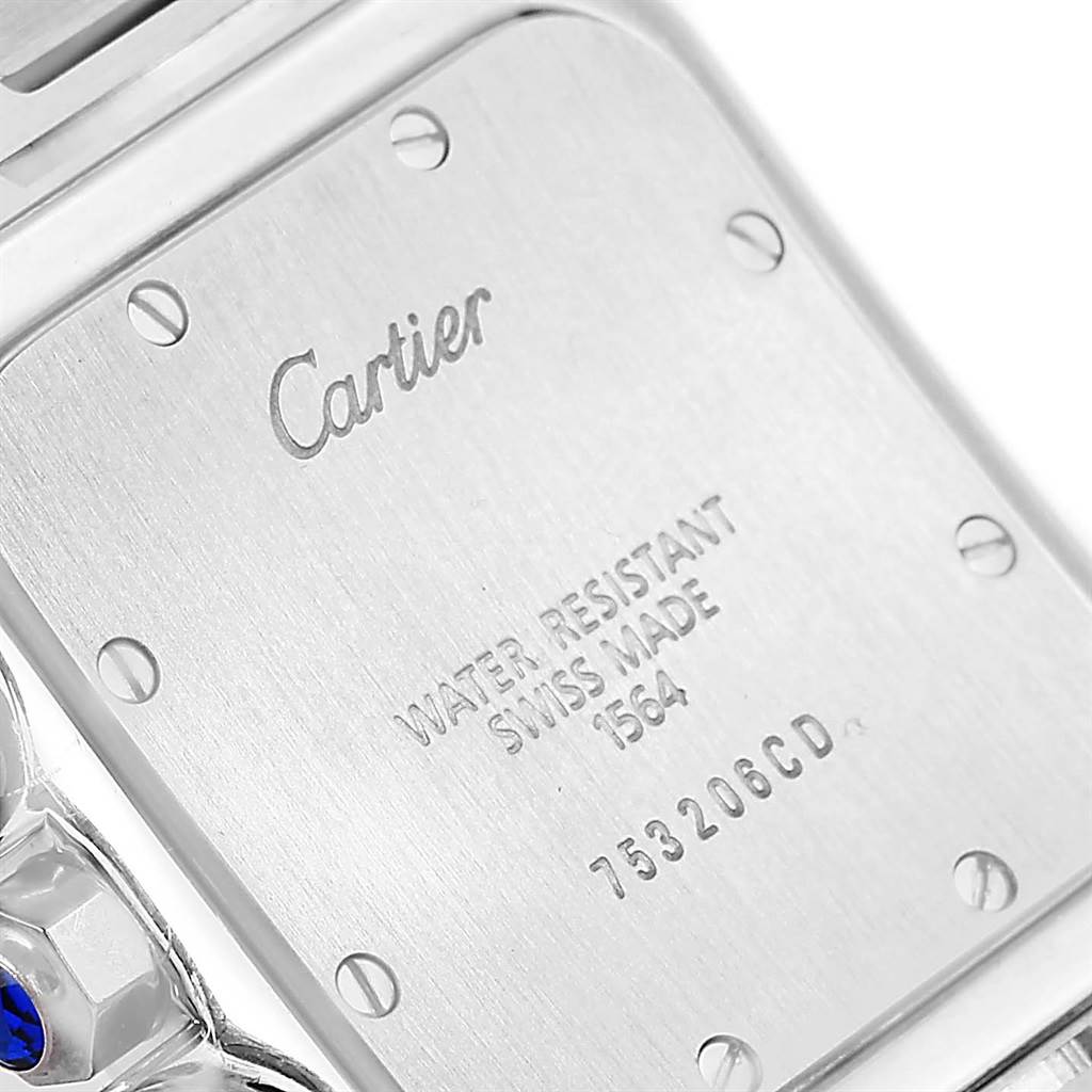 This image shows the back case of a Santos model watch by Cartier, including engraved information and screws.