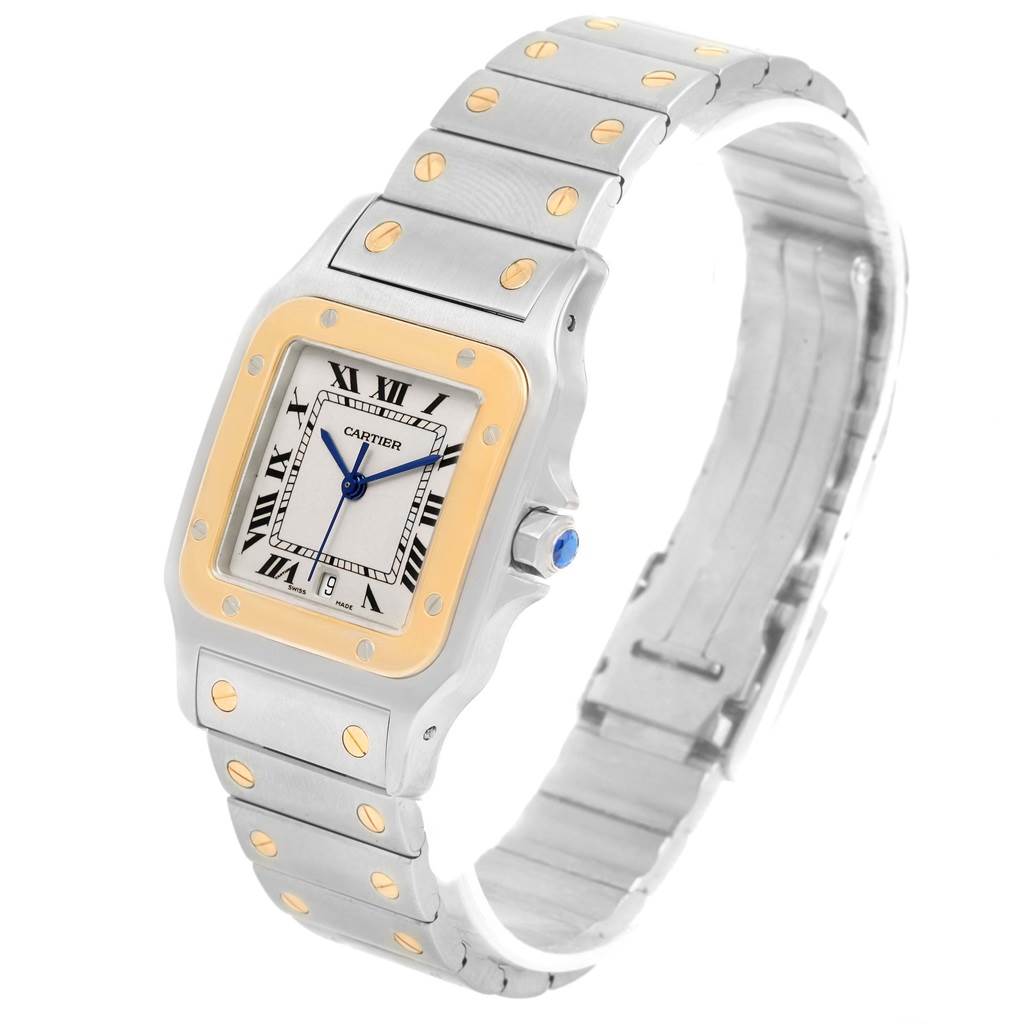 The Cartier Santos 187901 Men
s Stainless Steel Silver Dial 187901 Men
s Stainless Steel Silver Dial watch is shown at an angled side view, displaying its face, bezel, crown, and bracelet.