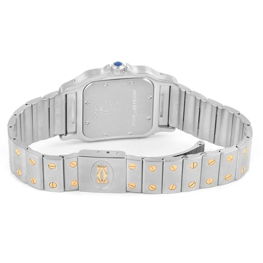 The image shows the backside and bracelet of a Cartier Santos 187901 Men
s Stainless Steel Silver Dial 187901 Men
s Stainless Steel Silver Dial watch, highlighting its clasp and screw details.