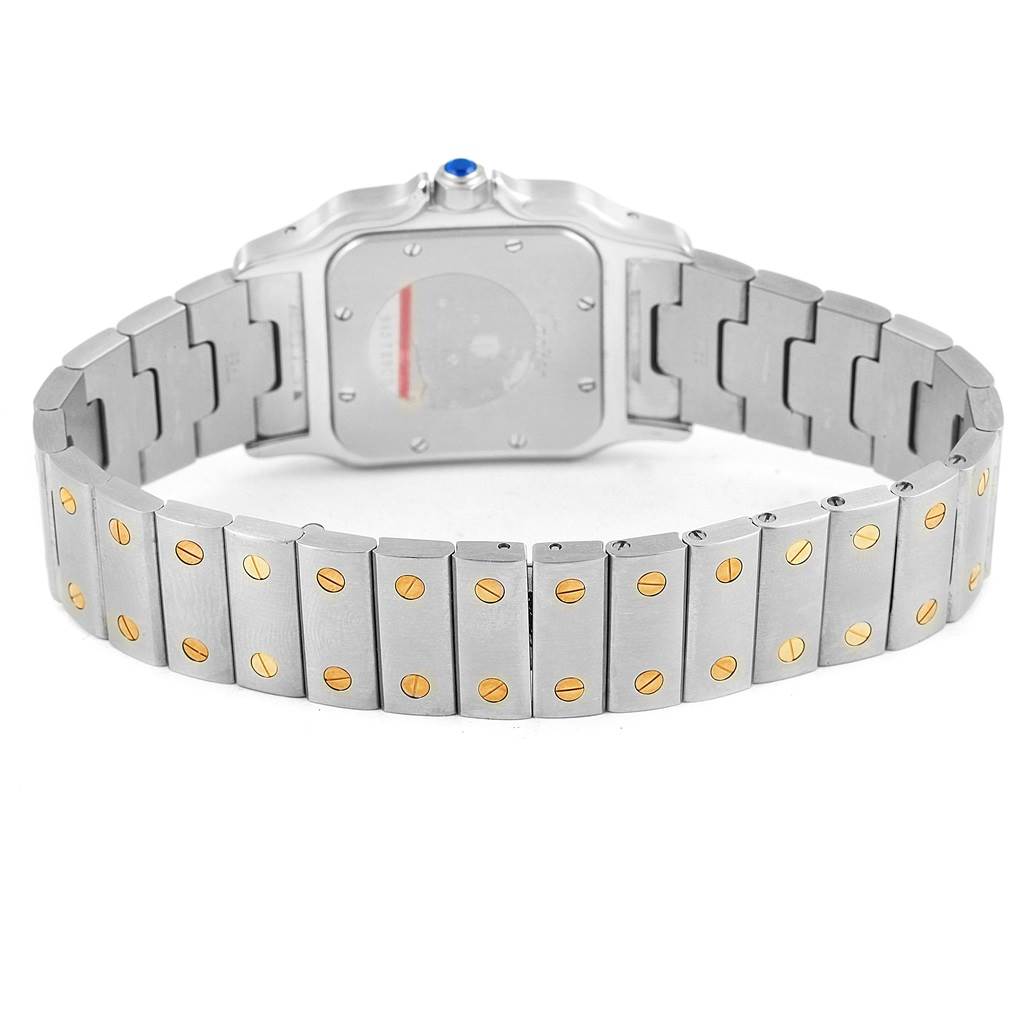 The image shows the back of a Cartier Santos 1566 Stainless Steel Silver Dial 1566 Stainless Steel Silver Dial watch, highlighting its metal bracelet with gold screws and the watch's case back.