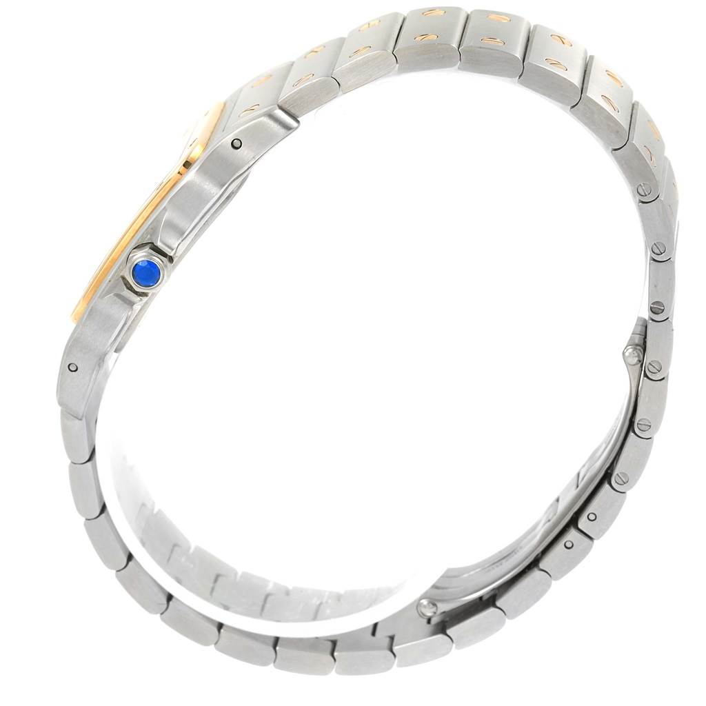 The image shows a side angle of the Cartier Santos 1566 Stainless Steel Silver Dial 1566 Stainless Steel Silver Dial watch focusing on its metal bracelet and crown with a blue cabochon.