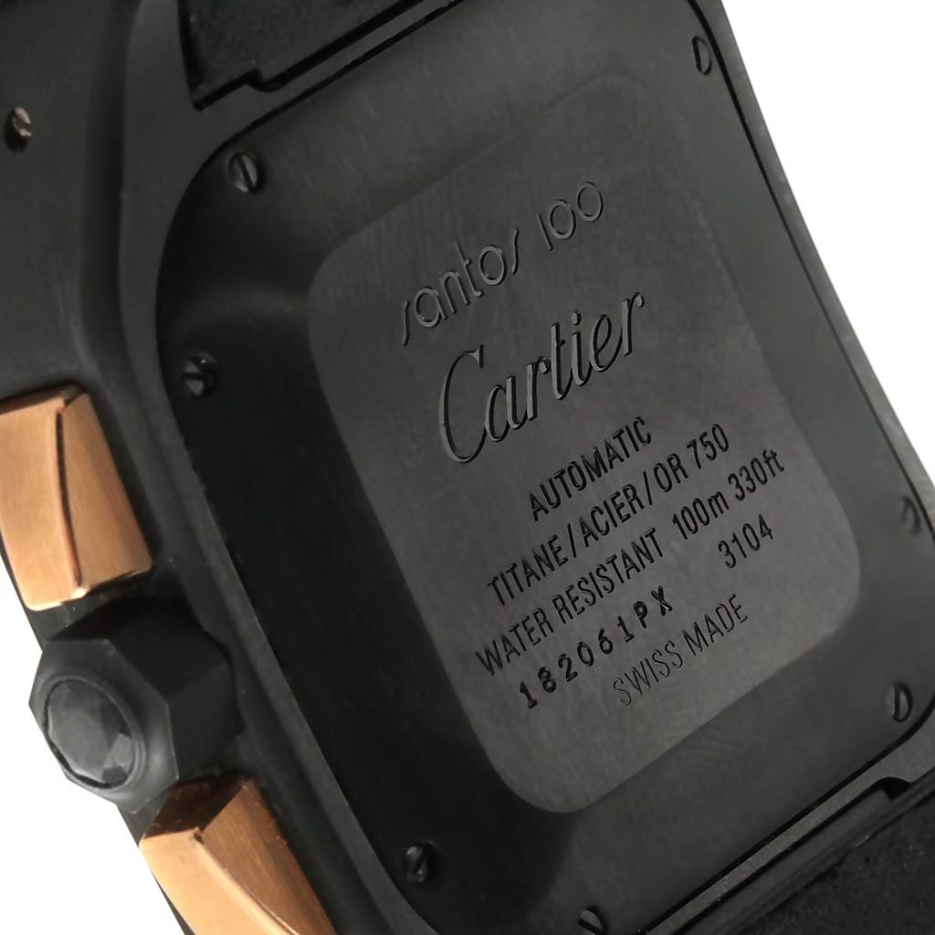 The image shows the back case of a Cartier Santos W2020004 Men's Titanium Black Dial W2020004 Men's Titanium Black Dial 100 watch, highlighting the engraving and material details.