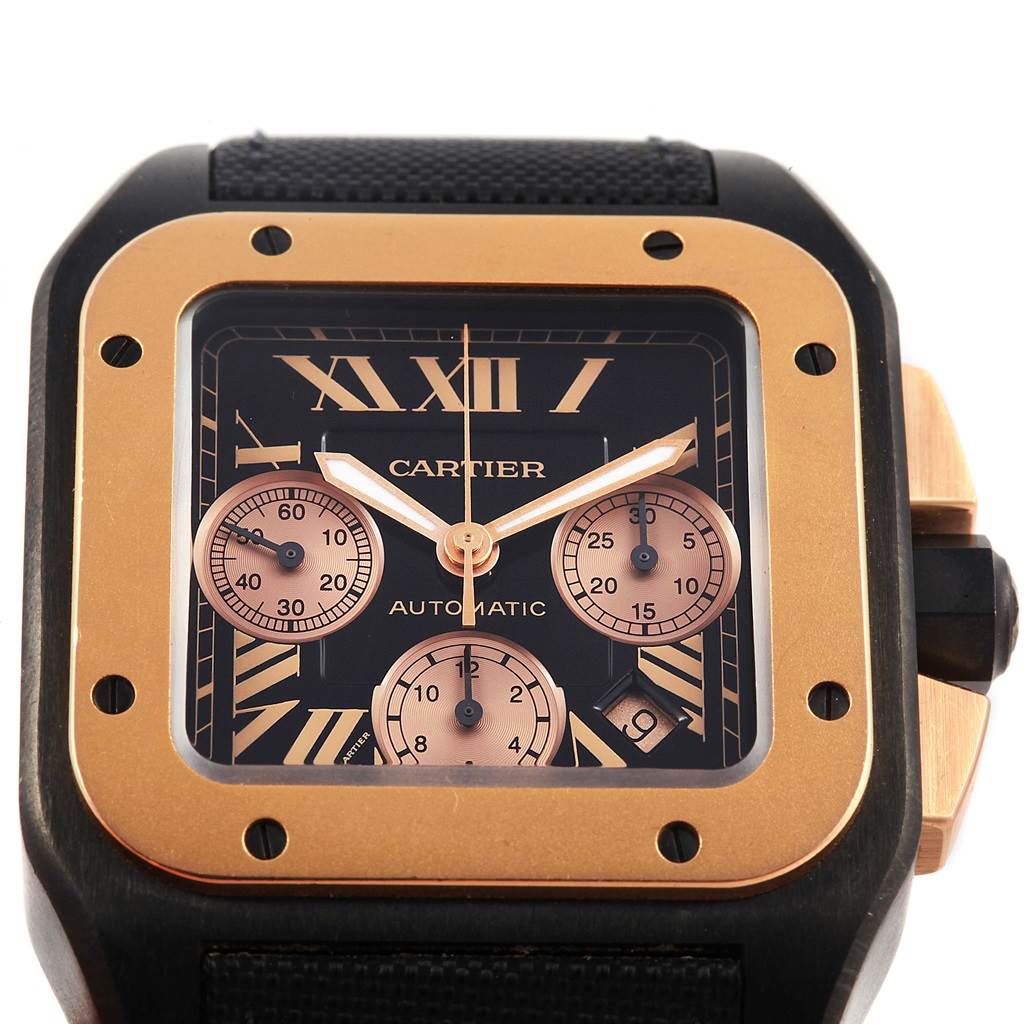 The image shows a close-up of the Cartier Santos W2020004 Men's Titanium Black Dial W2020004 Men's Titanium Black Dial watch face, featuring a black dial with Roman numerals, subdials, and gold accents.