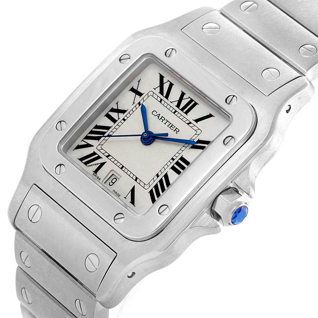 The Santos model by Cartier is shown at an angled view, focusing on the watch face, bezel, crown, and part of the bracelet.