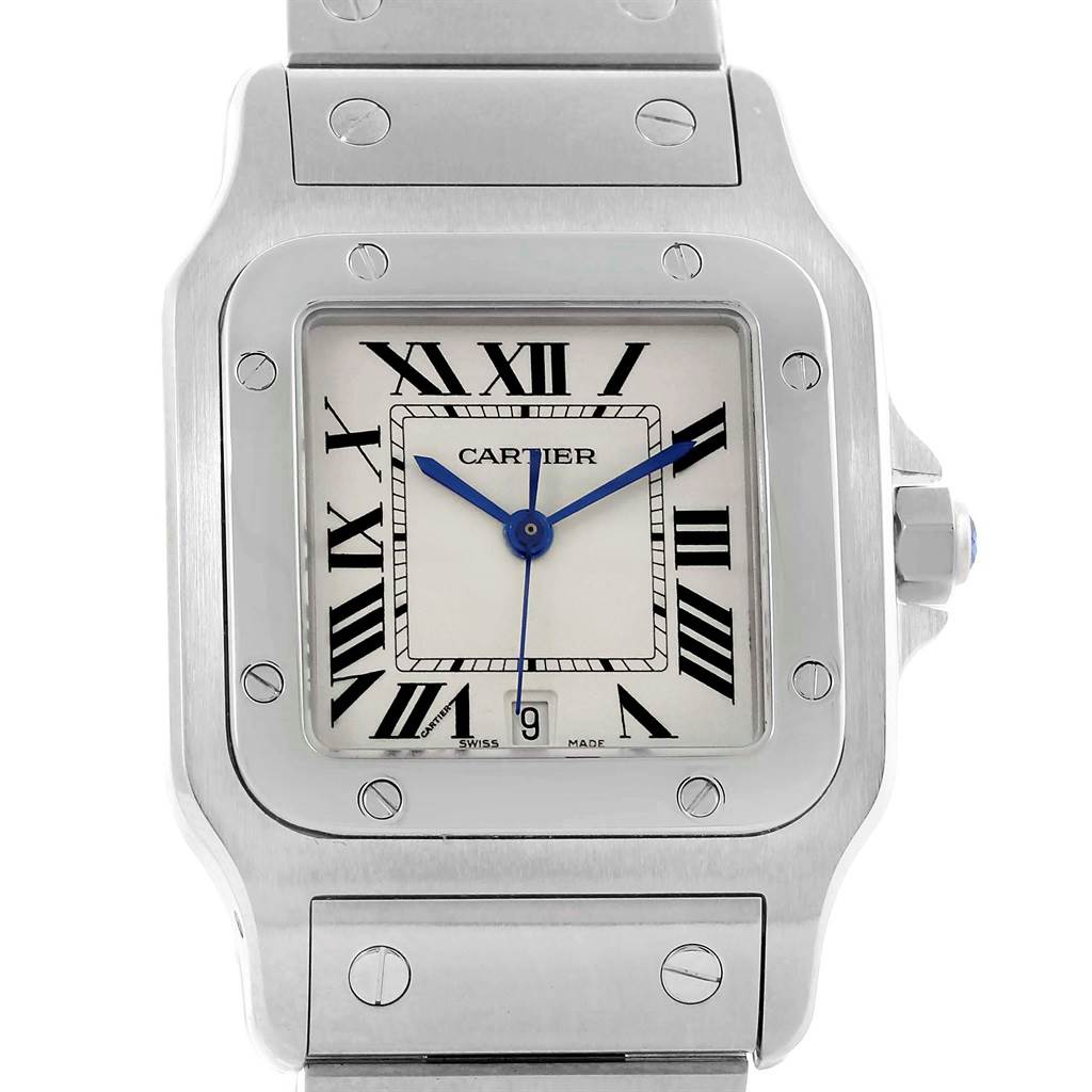 This image shows a face-on view of a Santos model Cartier watch, highlighting its white dial, Roman numerals, and metal bracelet.