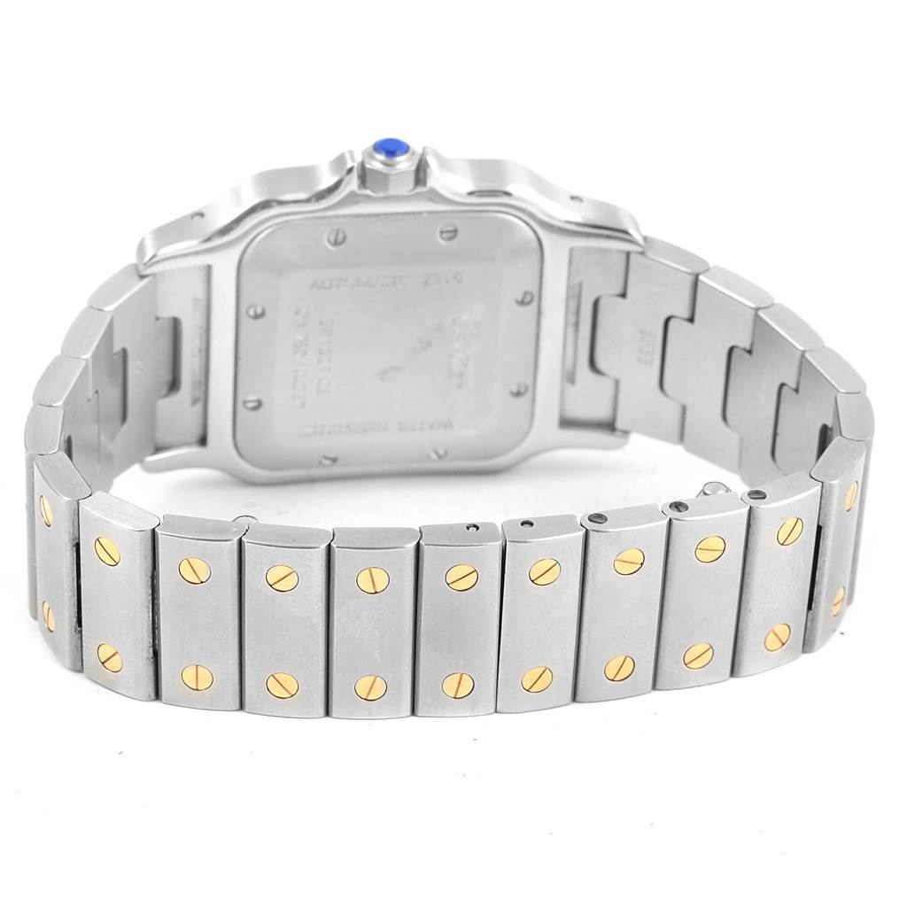 This image shows the back case and bracelet of a Cartier Santos W20058C4 Stainless Steel Silver Dial W20058C4 Stainless Steel Silver Dial watch, featuring its silver and gold screw accents.