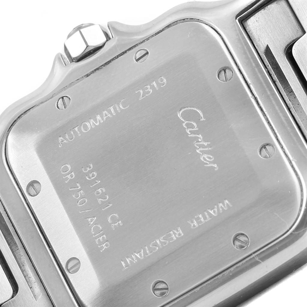 This image shows the back case of a Cartier Santos W20058C4 Stainless Steel Silver Dial W20058C4 Stainless Steel Silver Dial watch, viewed from a close-up angle.