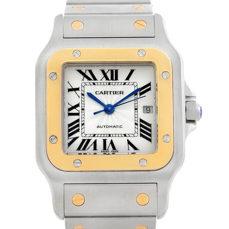 The Cartier Santos watch is shown from a top-down angle, displaying the face, bezel, and part of the bracelet.