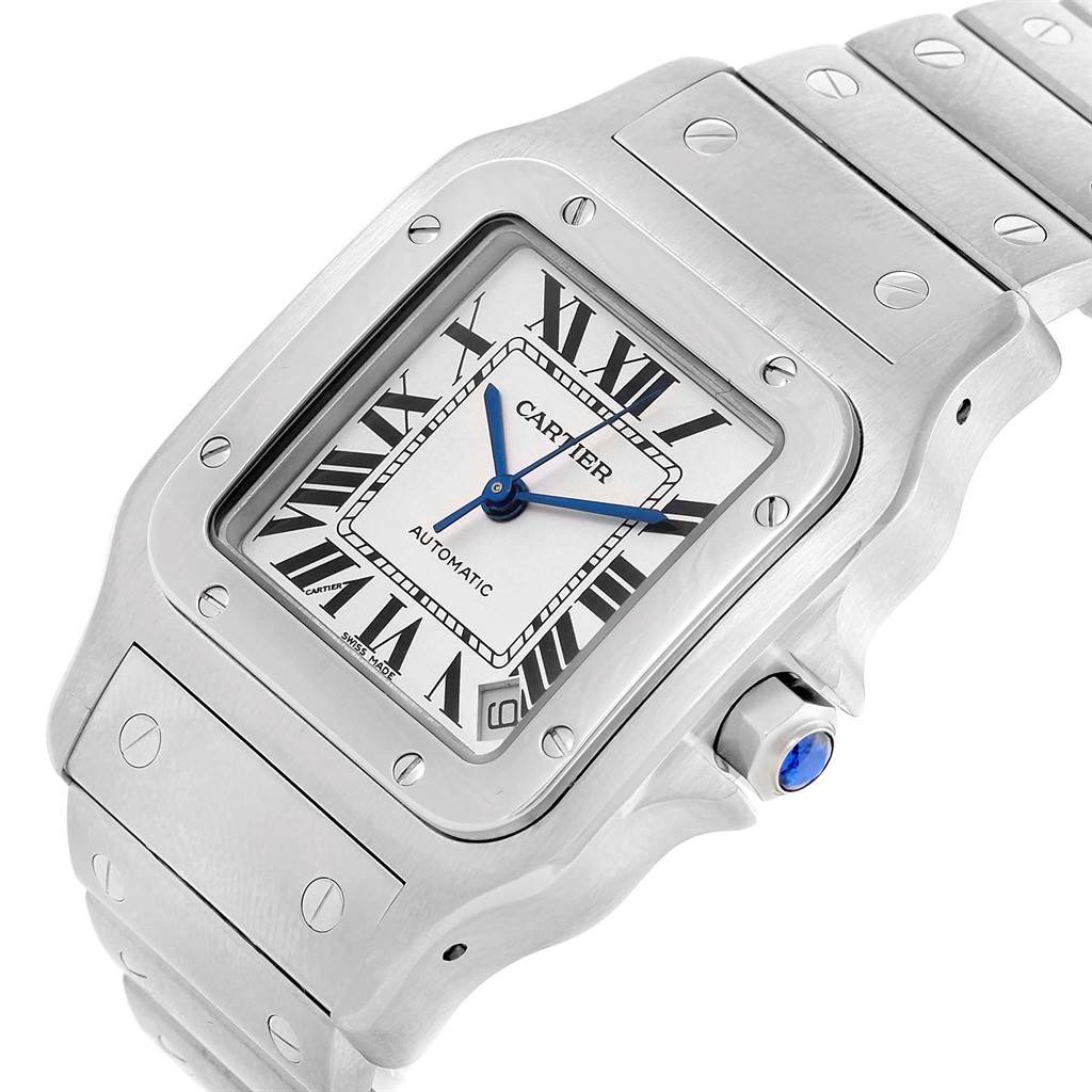 The image shows a Cartier Santos W20098D6 Men's Stainless Steel Silver Dial W20098D6 Men's Stainless Steel Silver Dial model watch face and part of its metal band from an angled top view.