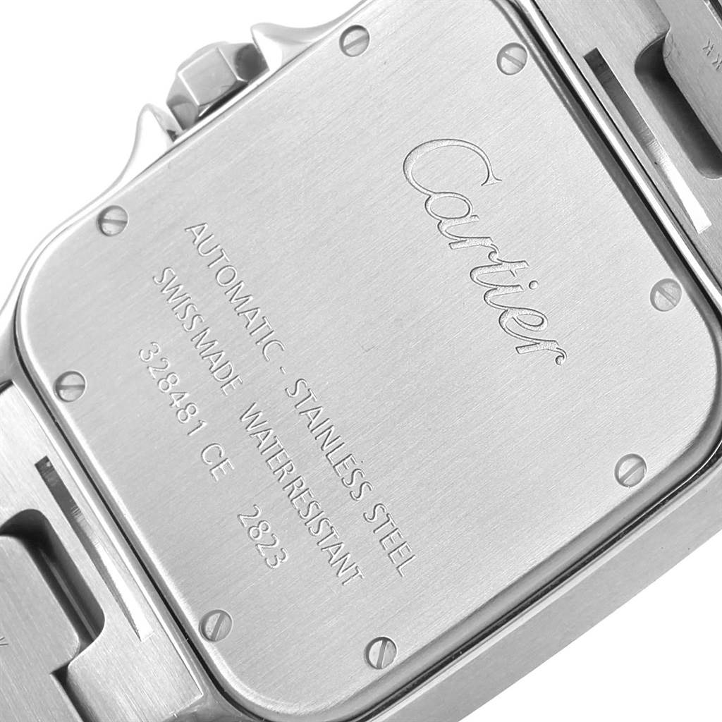 The image shows the case back of a Cartier Santos W20098D6 Men's Stainless Steel Silver Dial W20098D6 Men's Stainless Steel Silver Dial model watch, highlighting its inscriptions and screws.