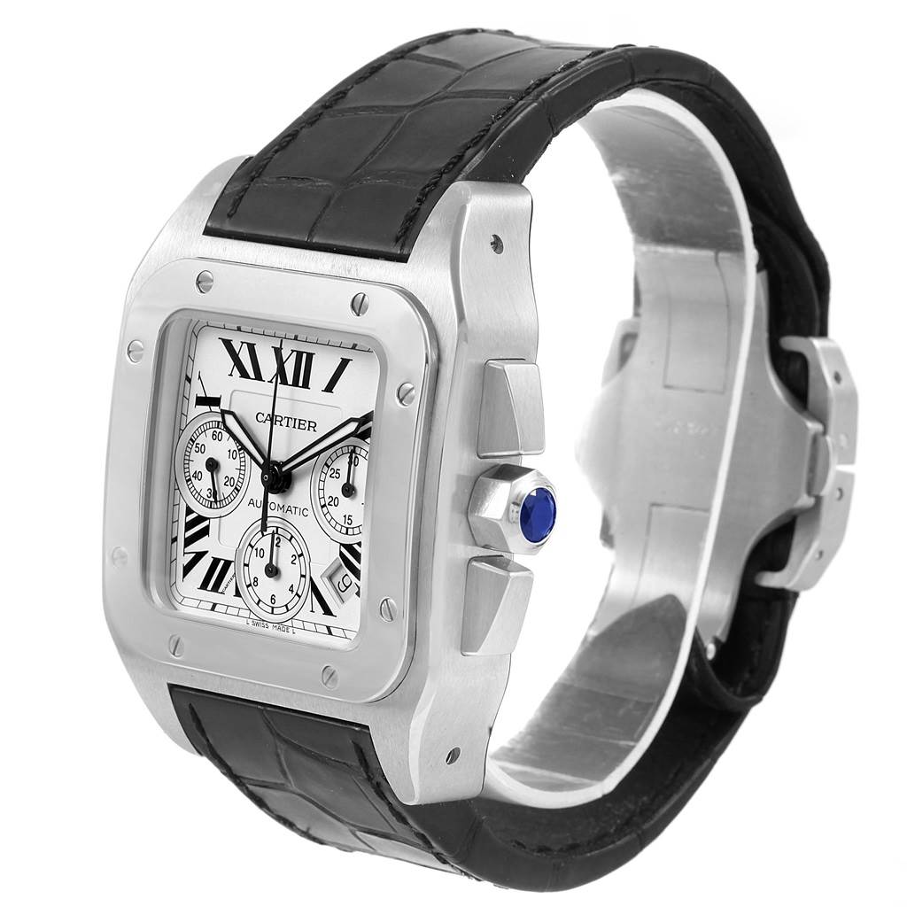 The image shows a Cartier Santos W20090X8 Men
s Stainless Steel Silver Dial W20090X8 Men
s Stainless Steel Silver Dial model watch from an angled side view, highlighting its face, bezel, crown with a blue gem, and black leather strap.