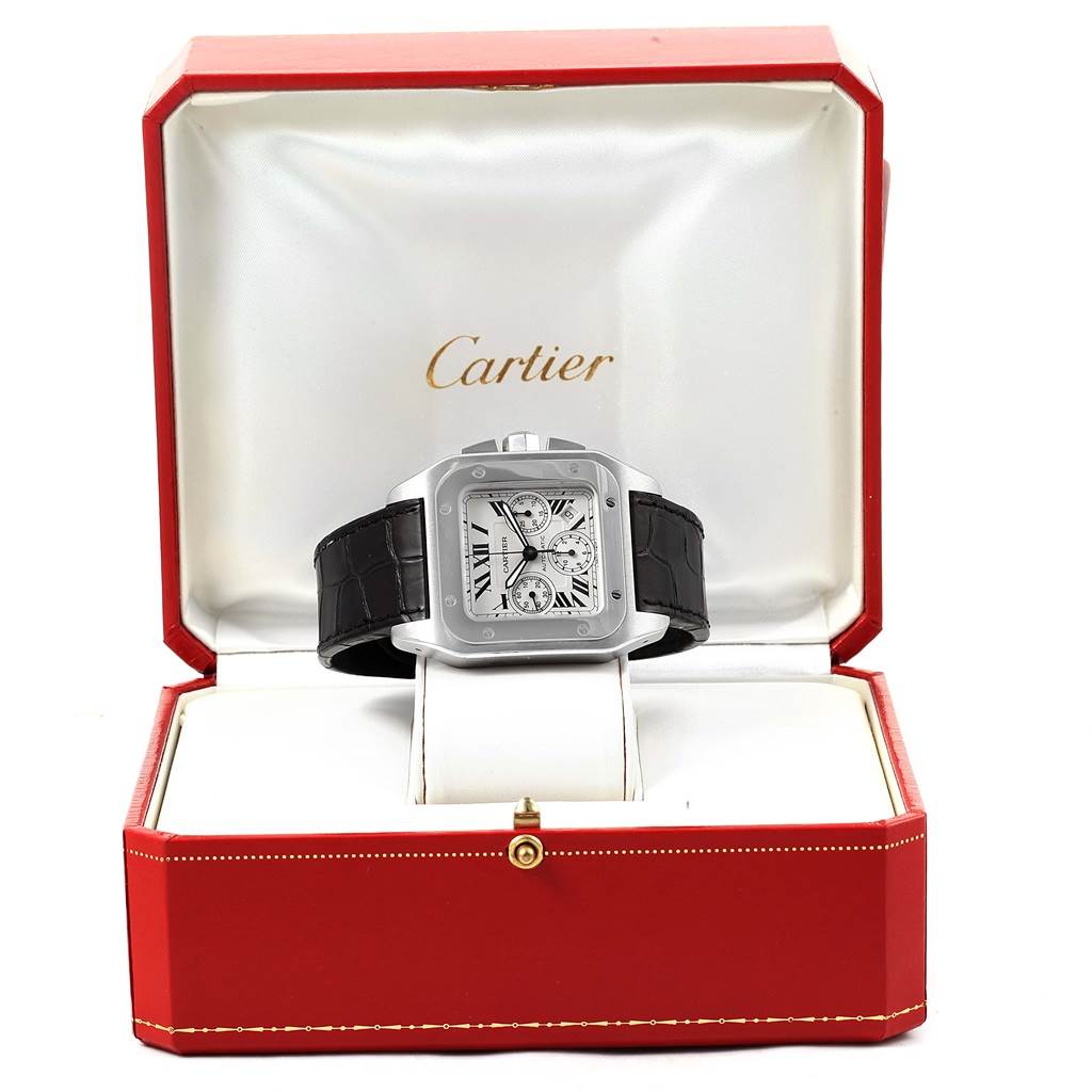 The Cartier Santos W20090X8 Men
s Stainless Steel Silver Dial W20090X8 Men
s Stainless Steel Silver Dial watch is shown from the front, displayed in its open red and white branded box.