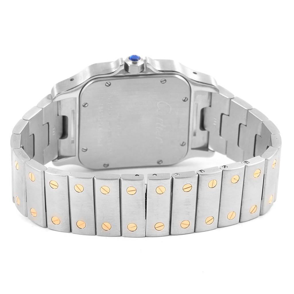 The image shows the back case and metal bracelet of the Santos model by Cartier, viewed from the rear angle.