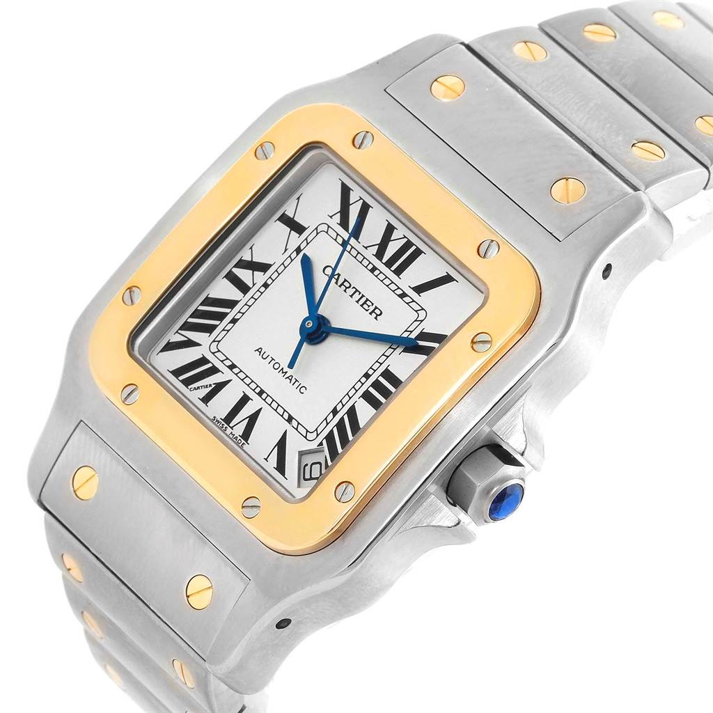 This image shows a close-up, angled view of a Cartier Santos W20099C4 Men's Stainless Steel Silver Dial W20099C4 Men's Stainless Steel Silver Dial watch, highlighting its face, bezel, and part of the bracelet.