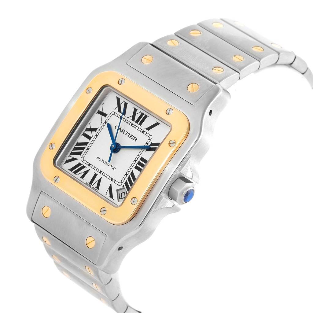 The Cartier Santos W20099C4 Men's Stainless Steel Silver Dial W20099C4 Men's Stainless Steel Silver Dial watch is shown from a front angle, highlighting the face, bezel, crown, and part of the bracelet.