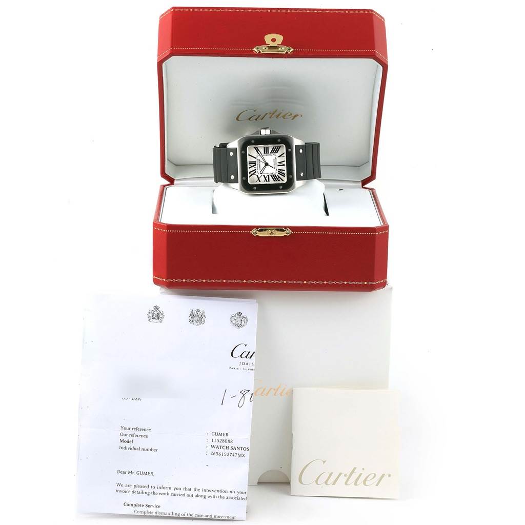 The image shows a Cartier Santos W20121U2 Men's Stainless Steel Silver Dial W20121U2 Men's Stainless Steel Silver Dial watch in its open box, along with associated documents and an outer box.