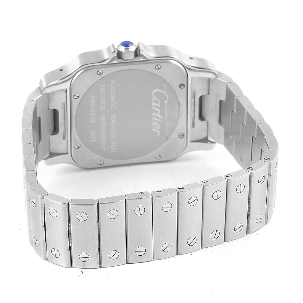 The image shows the back and partially open bracelet of a Cartier Santos W20098D6 Men's Stainless Steel Silver Dial W20098D6 Men's Stainless Steel Silver Dial watch, highlighting the case back and link screws.