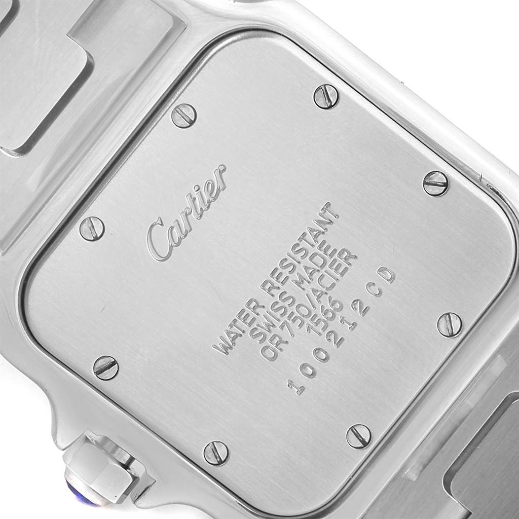 This is a close-up of the back case of a Cartier Santos W20011C4 Stainless Steel Silver Dial W20011C4 Stainless Steel Silver Dial watch, displaying brand engravings and model details.