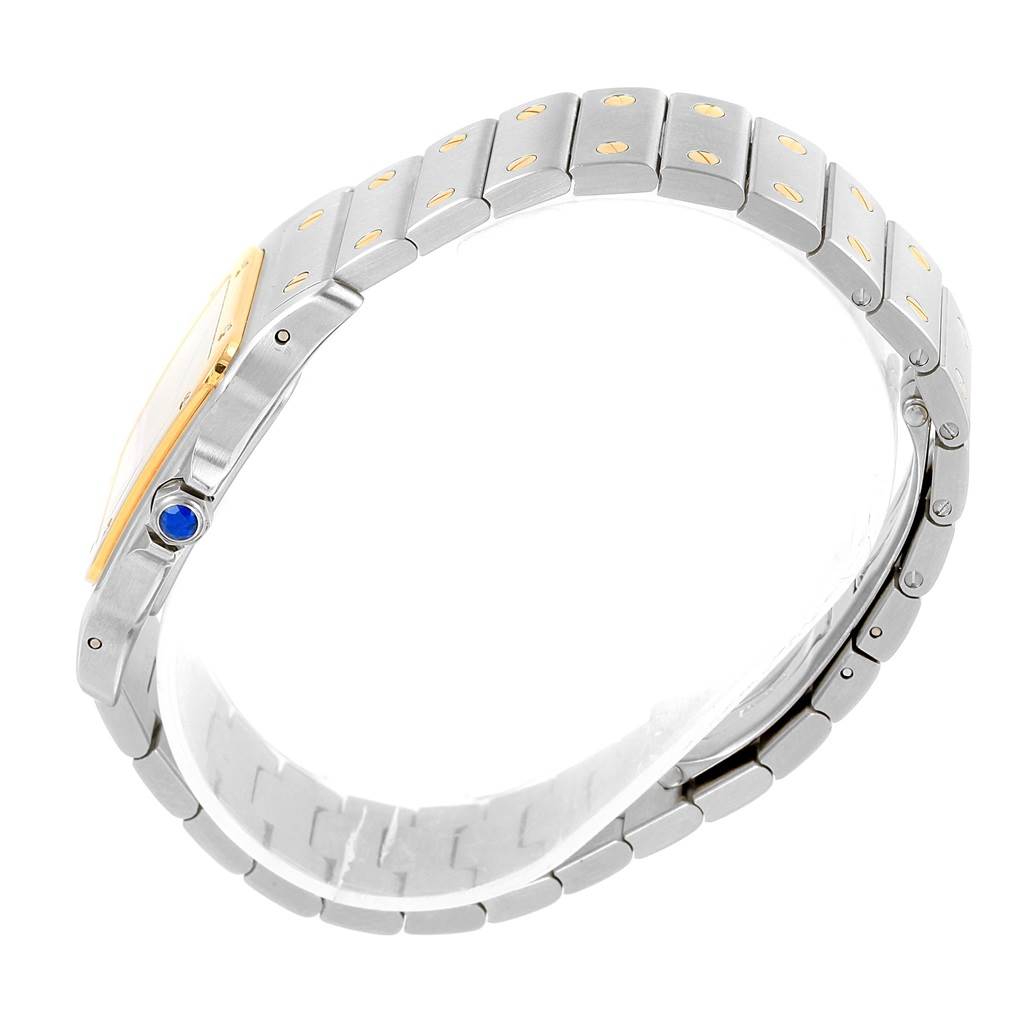 The Cartier Santos W20011C4 Stainless Steel Silver Dial W20011C4 Stainless Steel Silver Dial watch is shown from a side view, displaying its metal bracelet and blue crown.