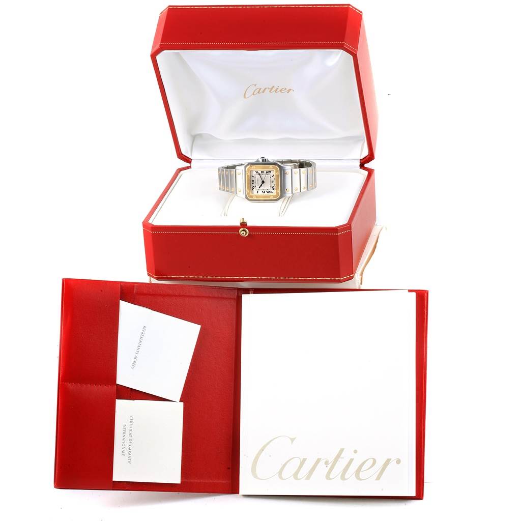 This image shows a Cartier Santos W20011C4 Stainless Steel Silver Dial W20011C4 Stainless Steel Silver Dial watch displayed in an open red Cartier box, accompanied by documentation.