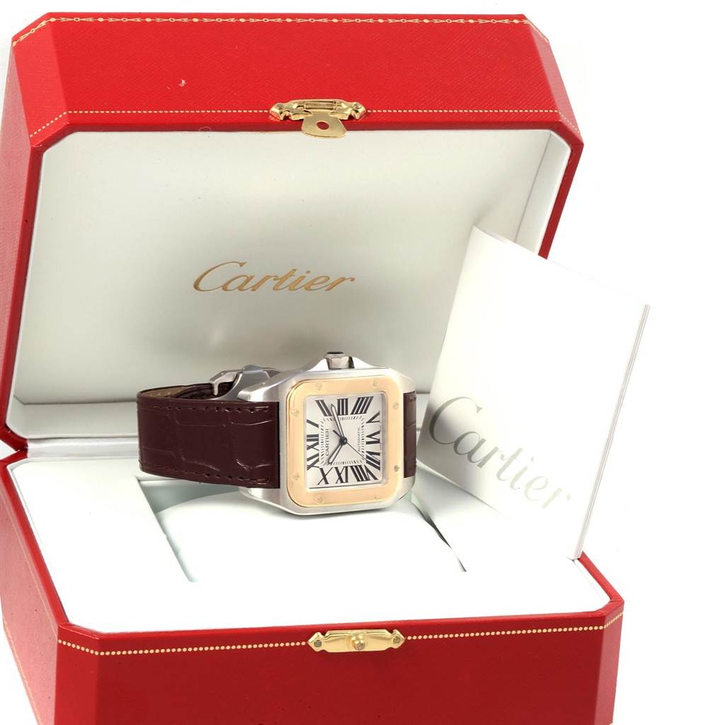 The Cartier Santos W20072X7 Men
s Stainless Steel Silver Dial W20072X7 Men
s Stainless Steel Silver Dial watch is displayed in its open red box with a booklet beside it.