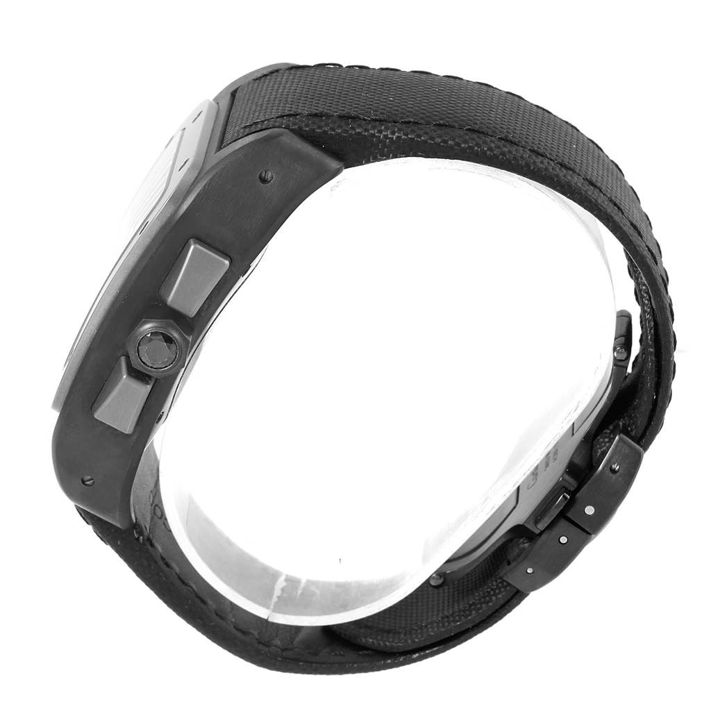 The image shows a side view of a Santos model watch by Cartier, highlighting the crown, side buttons, and part of the strap.