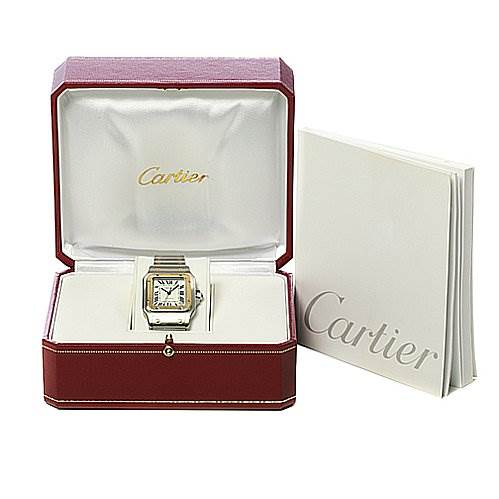 The Cartier Santos W20099C4 Stainless Steel Silver Dial W20099C4 Stainless Steel Silver Dial watch is displayed in an open box with a booklet beside it.