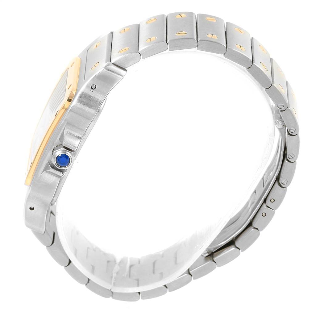 The image shows a side view of the Cartier Santos W20099C4 Men
s Stainless Steel Silver Dial W20099C4 Men
s Stainless Steel Silver Dial watch and its bracelet, highlighting the crown and metal links.