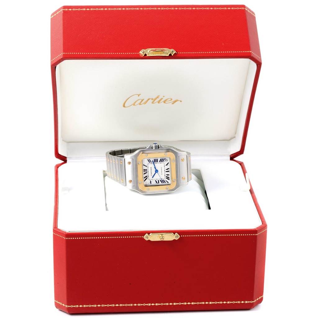 The Cartier Santos W20099C4 Men
s Stainless Steel Silver Dial W20099C4 Men
s Stainless Steel Silver Dial watch is shown at a front angle, inside its open red and white presentation box.